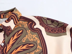 Close-up of printed resort shirt featuring a classic collar and colorful patterns