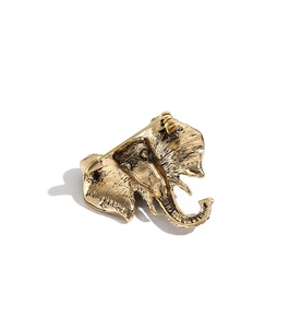 Detailed back view of vintage golden elephant brooch showing the secure metal safety pin clasp