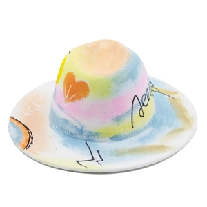 Detail of hand-painted wide brim felt fedora featuring colorful graffiti and heart patterns