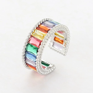 Adjustable gold plated open ring featuring colorful rainbow baguette cubic zirconia