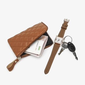 Brown quilted PU leather coin purse with zipper closure and cash storage capacity