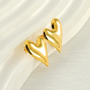 3D heart shaped stud earrings in 18K gold plated stainless steel on wavy background