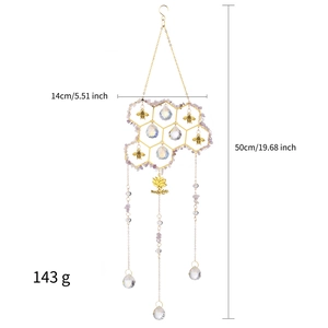 Detail view of crystal suncatcher showing 14cm width, 50cm length, and 143g weight specs