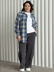 Relaxed fit blue plaid shirt styled with a white T-shirt and grey straight-leg trousers