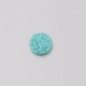 Macro detail of 6mm light blue round resin crystal druzy cabochon for DIY jewelry
