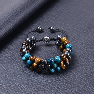 Macro shot of 8mm tiger eye and hematite triple layer adjustable braided men bracelet