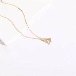 14K gold plated necklace featuring a sparkling zircon studded Christmas tree pendant