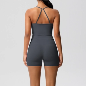 Detail of cross-back strap design on slim fit charcoal grey yoga bodysuit