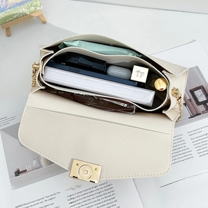 Elegant cream rectangular lady bag with texture leather, gold chain and spacious interior