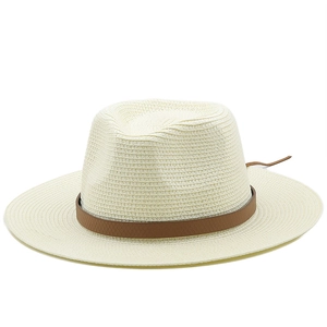 Detail of the woven paper straw texture and brown leather band on the panama hat