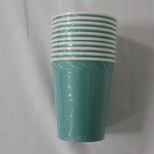 Macro shot of teal disposable paper cups with white rims wrapped in clear plastic film
