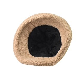 Detail of warm beige teddy fleece bucket hat with black quilted diamond inner lining