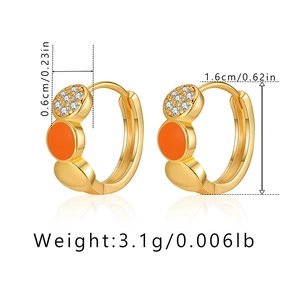 Detail view of orange enamel gold hoop earrings with small crystals and size measurements