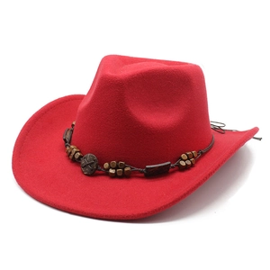 Detail of red wool felt cowboy hat featuring a brown beaded band and carved wooden buckle