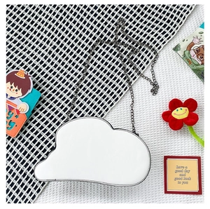 White cloud-shaped crossbody bag with metal chain strap and decorative black edge stitching