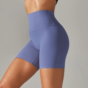 Detail of high-waisted blue yoga shorts showing seamless texture and elastic stitching