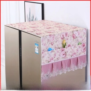 Linen dust cover with floral pattern, lace hem, and storage pockets for microwave