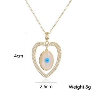 Detail view of 18K gold plated evil eye heart pendant necklace with size dimensions
