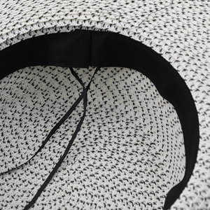 Flat top straw hat with black and white woven texture and adjustable inner sweatband
