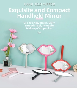 Close-up of lip-shaped hand-held makeup mirrors in various colors on a white table