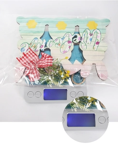 Detail of wooden Easter welcome sign showing weight on a digital scale for home decor