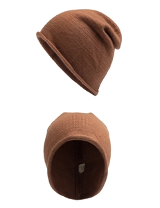 Detail view of brown knit beanie showing soft wool texture and internal wash label