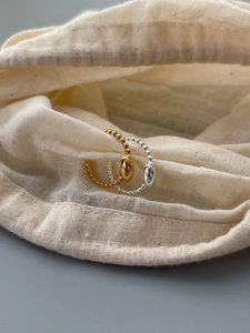 Minimalist S925 silver beaded rings with oval bean charms in gold and silver finishes