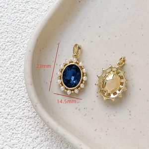Detailed macro view of an 18k gold-plated oval zircon pendant with white pearls