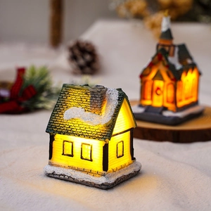 Detailed close-up of a glowing Christmas miniature house with warm LED light and snow texture