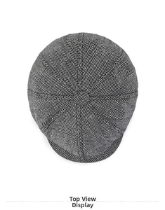 Top down view showing high quality black and white herringbone fabric of this flat cap