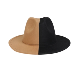 Detail of a two-tone fedora hat in khaki and black with wide brim and felt texture
