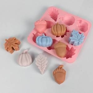 Detail of pink silicone mold with autumn pumpkin acorn and leaf shapes for DIY crafts