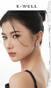 Chic S925 sterling silver tassel earring with irregular lava texture shown on a model