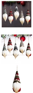 Detail of knitted Christmas gnomes with snowflake patterns and rustic jute hanging ropes