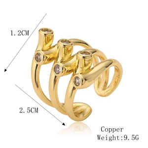 Detailed view of wide copper ring with three layered bands and cubic zirconia accents