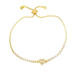 Detailed view of golden heart tennis bracelet with sparkling cubic zirconia and slider clasp