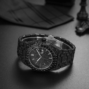 Detailed macro view of the black octagonal bezel and band encrusted with crystals