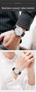 Detail of quartz watch with roman numerals, date display and black leather strap