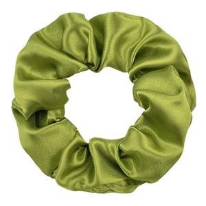 Close-up of grass green satin scrunchie showing glossy silk texture and pleated design