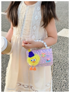 Girl's purple sequin crossbody bag with pearl handle and plush duck detail