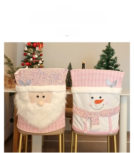 Detail of pink Santa and Snowman chair covers with sequins and faux fur texture