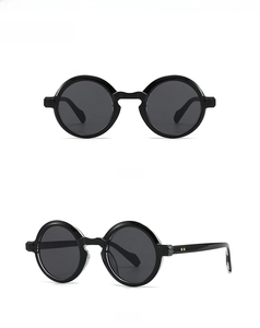 Front and 45-degree side view of vintage round black sunglasses on a white background