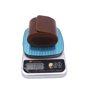 Detailed macro shot of 138g lightweight brown PU leather triple watch storage case