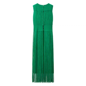 Detail shot of emerald green sleeveless knit dress featuring long hanging fringe tassels