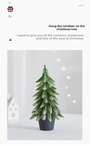 Mini Christmas tree with snow-covered needles in a black pot for holiday table decor