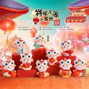 Detailed view of Chinese zodiac gold snake figurines with festive lion hats and lucky charms