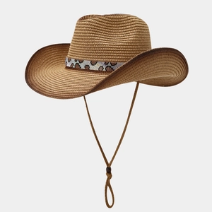 Close-up of straw cowboy hat featuring leopard print band with sequin beadwork and chin strap