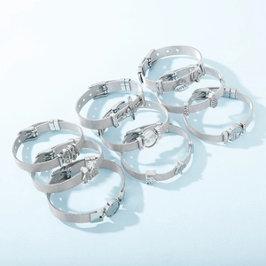 Silver stainless steel mesh bracelet set with heart and round charms engraved with LOVE