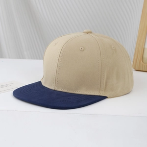 Detail of a two-tone khaki and navy blue hip-hop flat brim baseball cap for kids
