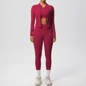 Three-piece berry red yoga set featuring a zip-up jacket, crop top, and high-waist leggings